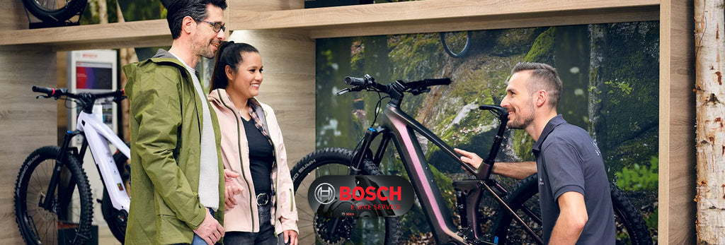 man and woman is asking about bosch bike